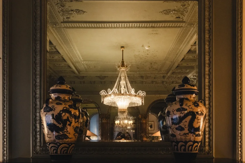 Vases and chandelier reflections